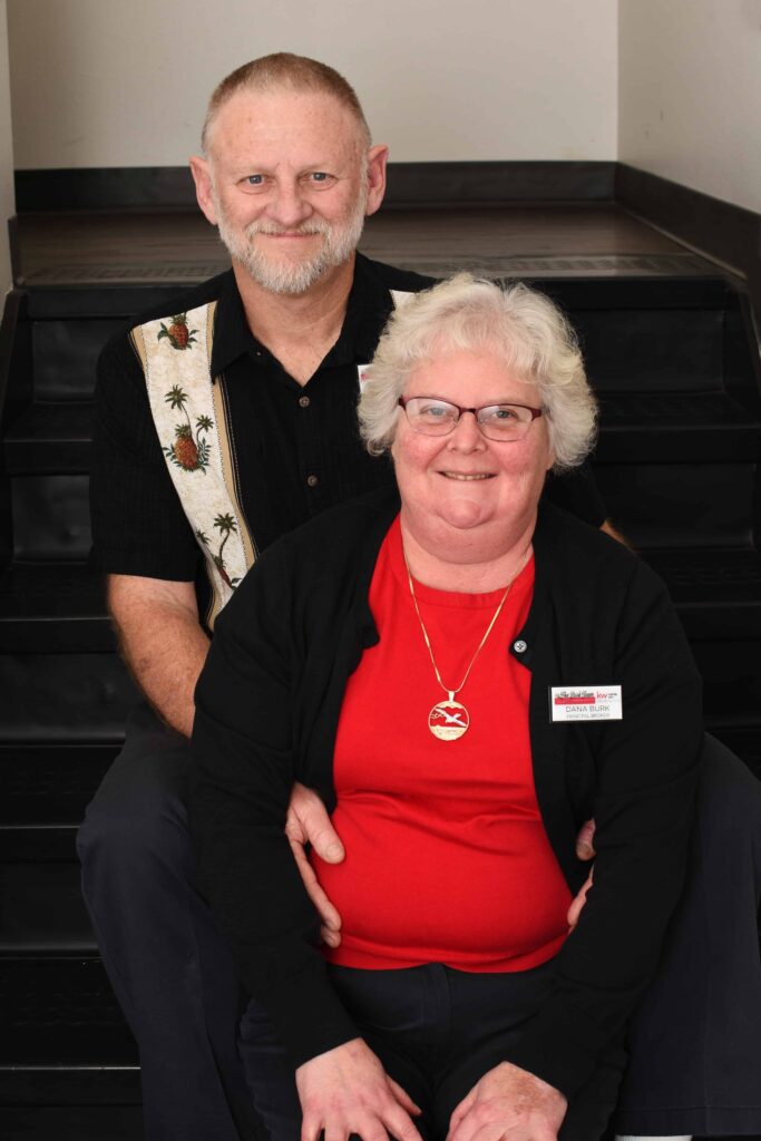Dana & Alan Burk smiling together at a social gathering.
